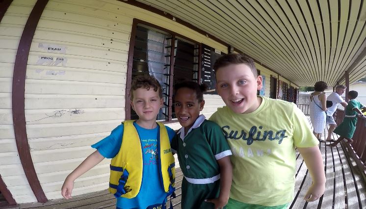 Andrea and Mattia with a friend, Ratu Namasi Memorial School, Yasawa Island, Fiji. Author and Copyright Marco Ramerini